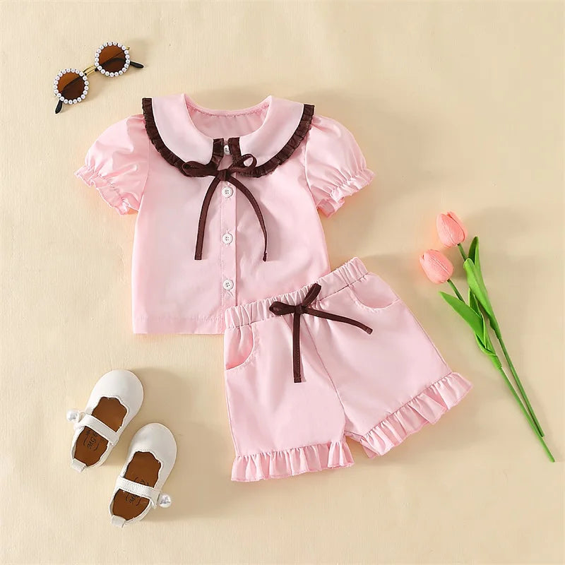 Girls Summer Pajama Set with Cute Doll Collar Short Sleeve Button Down Top and Ruffled Shorts Sleepwear in Vibrant Colors