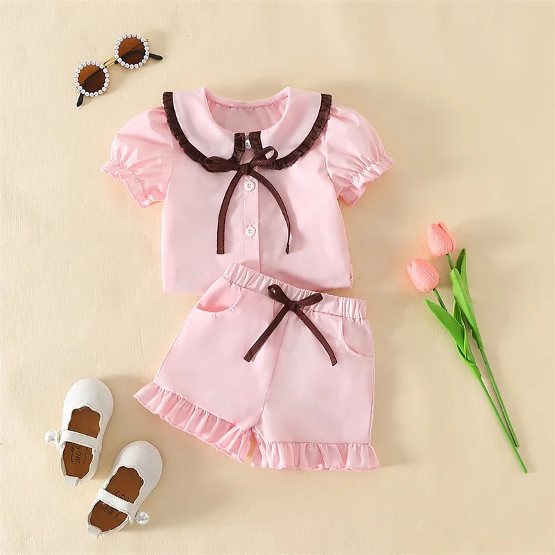 Girls Summer Pajama Set with Cute Doll Collar Short Sleeve Button Down Top and Ruffled Shorts Sleepwear in Vibrant Colors